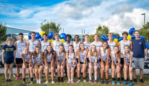 The cross country team celebrates their high placement at the meet and senior night at Kellam High School on Wed., Oct. 13, 2021. 
