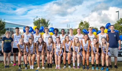 The cross country team celebrates their high placement at the meet and senior night at Kellam High School on Wed., Oct. 13, 2021. 