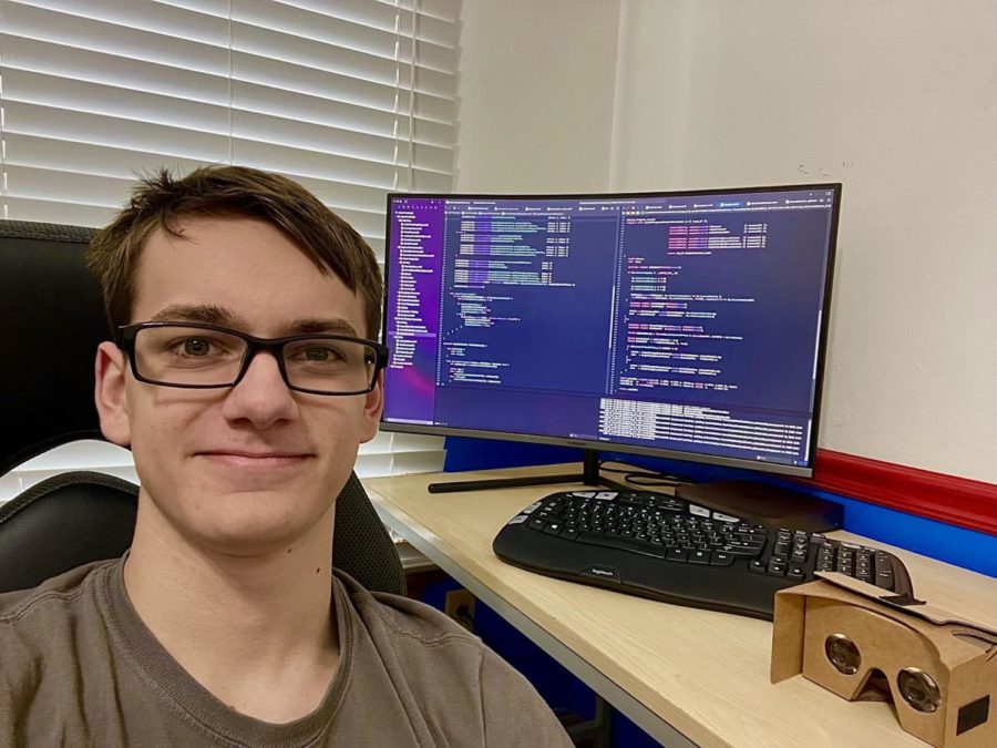 Math and Sciences Academy senior Philip Turner models his headset, coding in his house at the start of the school year to show what he created over summer vacation.