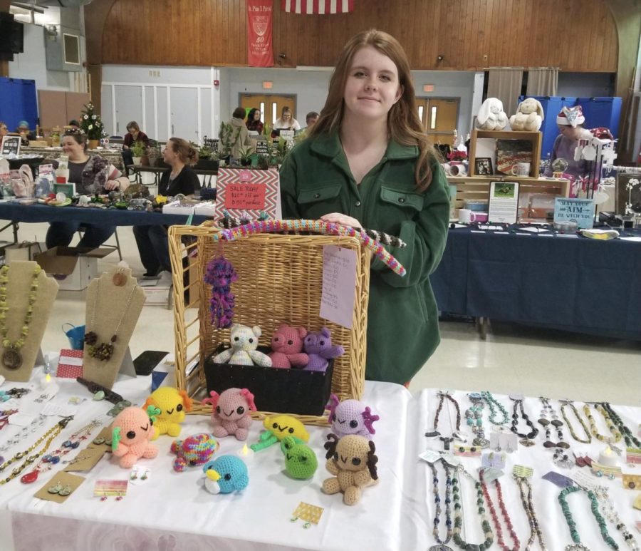 Junior Liz Strong sells homemade crochet items at St. Pius X Church Winter Holiday Fair on Dec. 4. 