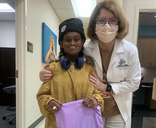 Patient receives her smile bag from Operation Smile Club on Jan. 17, 2022.
