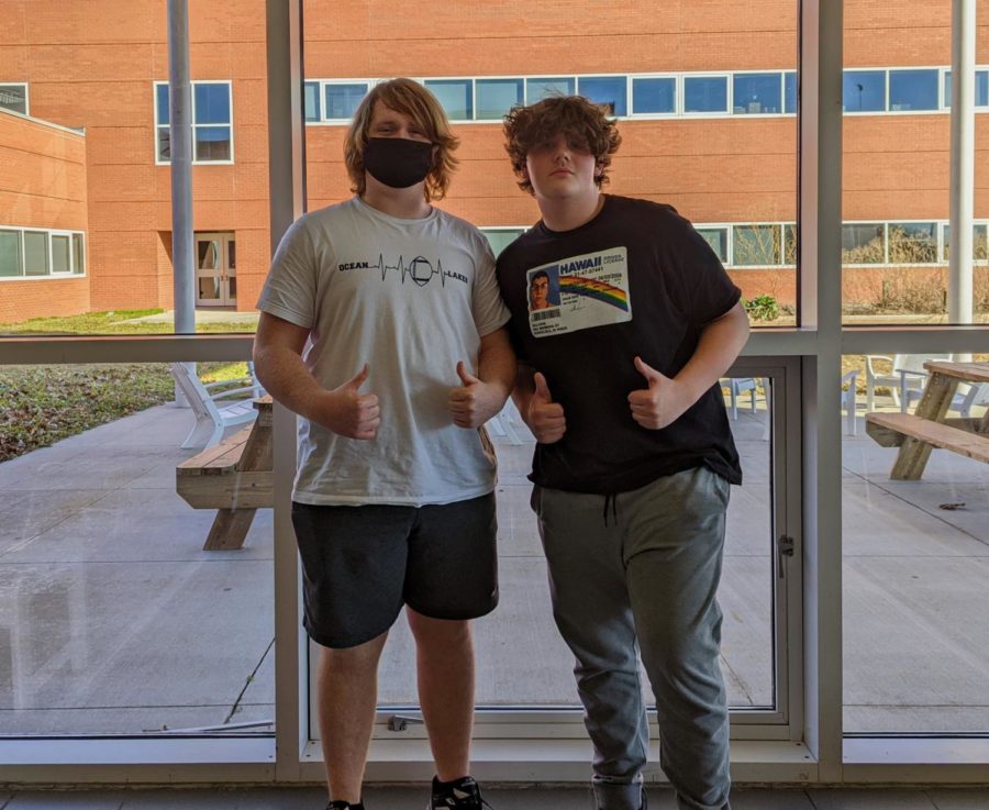Grady Insley (left) and Blake Ledford (right) pose together for a photo in the cafeteria without being required to wear masks.