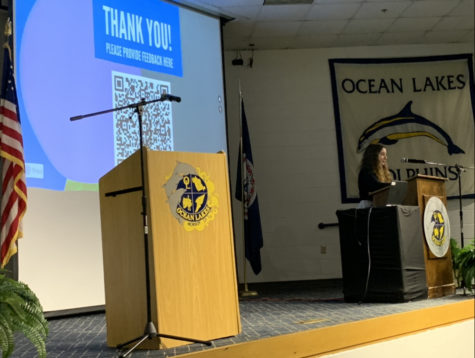 Senior Kaitlyn Hertz presents “Pain Means No Gain” project on March 2,2022 in the Ocean Lakes High School Schola.