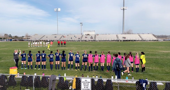 Girls soccer stands on home turf to face Cox Falcons on March 22, 2022.