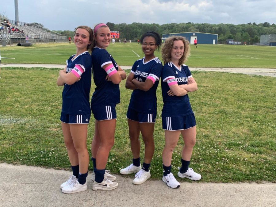 Girls soccer varsity captains, Ellie Kain-Kuzniewski, Emily Box, KaBria Ross, and Sierra Clark, stand proud after a pod game win 3-2 against Princess Anne at Ocean Lakes High School.