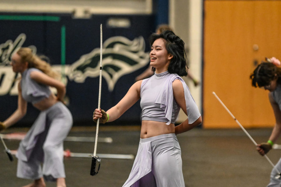 Color Guard performs their show Flora at South County High School on March 26, 2022.