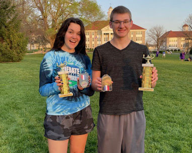 Juniors Cheyenne Kandiyeli and Jacob Gronniger posing for a victory photo after winning VHSL debate state championships for public forum at JMU April 23, 2022.