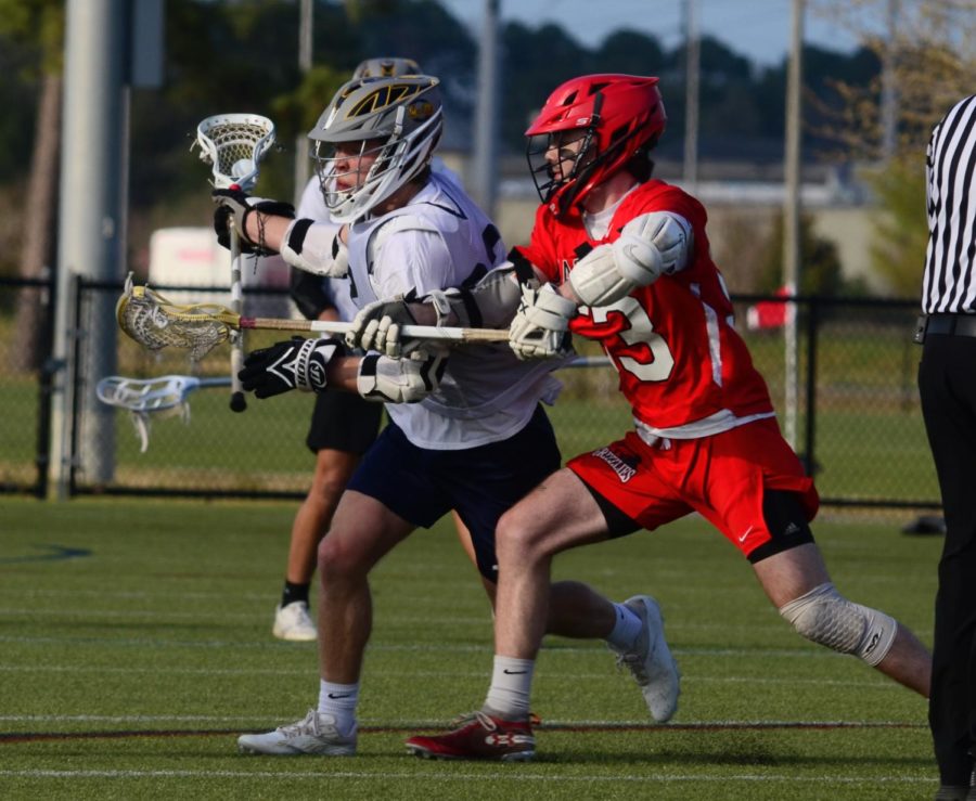 Senior Sean Kerrigan charges towards the goal after winning the face-off against Grassfield on March 30 at the Princess Anne Athletic Complex.  