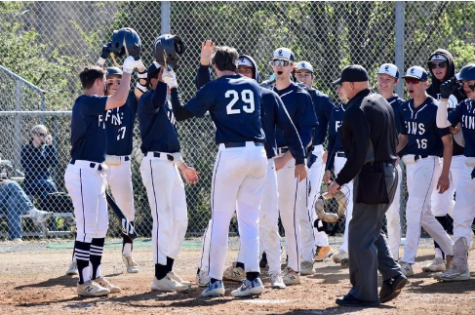 Varsity Baseball celebrates after a home run hit by Blake Dickerson on April 2, 2022 during their game against  Godwin.