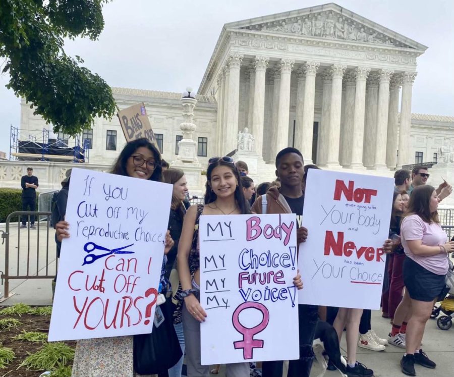 Teenagers: Abeisha, Emma, Jacolby protest in front of the Supreme Court on May 7, 2022. 