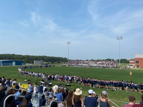 Students, faculty and staff gather together for the traditional “we are somebody” speech at the football stadium on May 20, 2022.