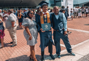 Dolphin Medallion recipient Marcell Whitfield celebrates Class of 2022s Graduation at the Virginia Beach Convention Center. Friends and family gathered outside the Pavilion for photos and hugs.