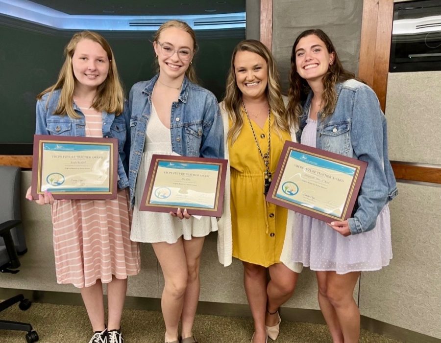 Kayla+Rockhill%2C+Ava+Estes%2C+Jordan+Turner%2C+and+Maggie+Reed+accept+their+certificates+on+May+24%2C+2022+at+the+School+Board+Meeting.%0A
