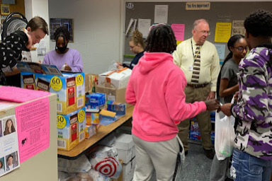 John Williams and AVID 12 students pack Beach Bags for students in need in room 161 on Sept. 20, 2022.