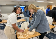 Michelle Medina and Keri Halko making different shape and stacking planks at the Society of Women Engineers meeting on Oct. 18, 2022 in room 258 