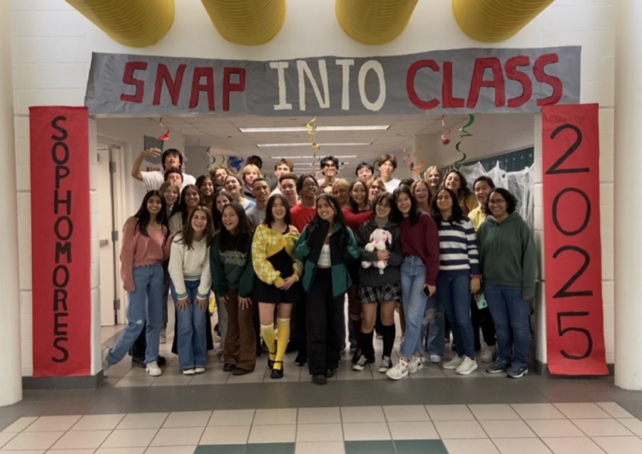 Class+of+2025+executive+team+stands+in+front+of+their+decorated+hallway%2C+ready+for+the+homecoming+decoration+contest+in+early+October.