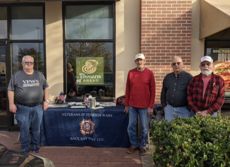 From left to right; VFW members Kevin Jared, Mel Carr, Dick Reedy and Charlie Baker hand out Buddy Poppies in celebration of Veterans Day on Nov. 11, 2022