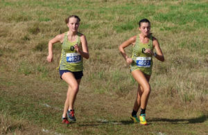 Sophomores Lindsay Meadows and Riley Gomez race in the VHSL 6A Regional meet on Nov. 5 at Bells Mill Park, Chesapeake.
