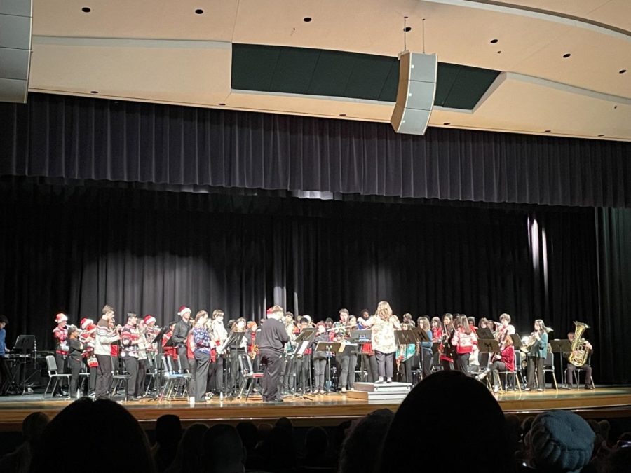 The four bands; Beginning Band, Percussion Ensemble, Symphonic Band and Wind Symphony, combine on stage to perform ‘Linus and Lucy’ arranged by Sweeny, in tribute to a band student who passed away years ago. The concert took place on Dec. 15 in the Ocean Lakes auditorium. 