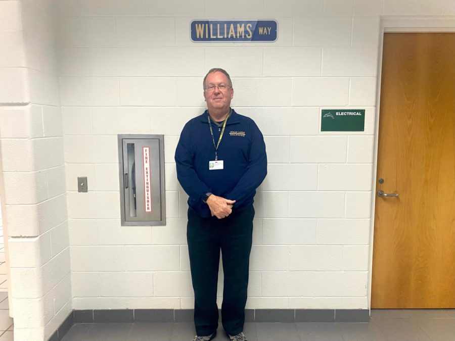 John Williams stands in front of his newly dedicated hallway, Williams Way on Dec. 16, 2022.