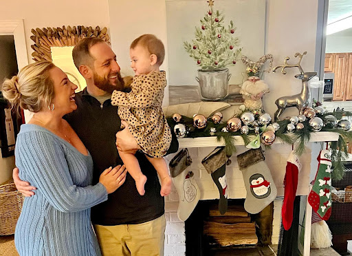 AP Environmental Science and Oceanography teacher Santo Ripa models his Christmas decorations with his wife Addie Ripa and daughter Rory Ripa on Dec. 4, 2022.