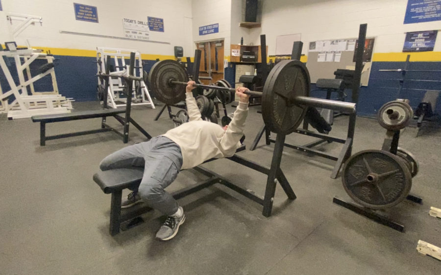 Sophomore Kai England works towards his New Year’s resolution of 315 pounds on bench press by the end of 2023. Currently, he is able to bench 225, but plans to work out every day to reach 315.
