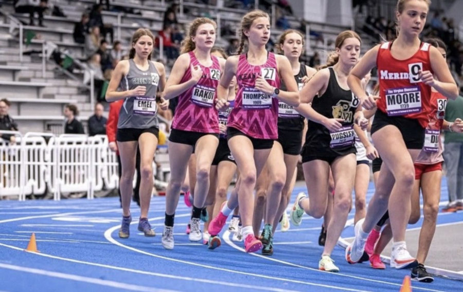 Sophomores Lauren Rakov and Grace Thompson compete in the two-mile race at The Va. Showcase in the Virginia Beach Sports Center on Jan. 14, 2023. 