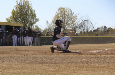 Ryan Gocio during the 4th inning, practicing with pitcher Blake Dickerson on Mar. 15, 2023. 
