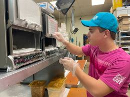 Junior Lex Wolf fulfills customer orders at Tropical Smoothie Cafe on Jan. 25, 2023.