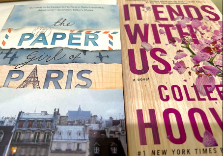 Less known book The Paper Girl of Paris by Jordyn Taylor is shown beside the popular BookTok novel It Ends with Us by Colleen Hoover.