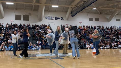 Ashley Adams and Eric Jaworski get pied in the face at the Spring Assembly as a way to fundraise for the Class of 2025 on April 7, 2023. 