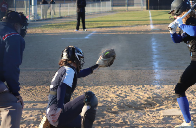 Ashley Bush catches a pitch against Landstown on March 15, 2023 at Landstown High School.
