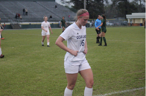 Junior Anna Kain-Kuzniewski walks off the field in defeat after a 1-1 draw against Great Bridge High School on Mar 28, 2023.