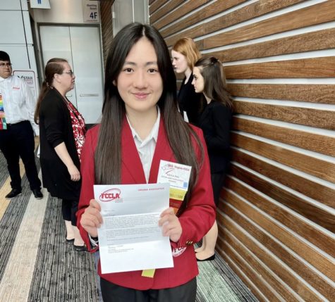 Sophomore Kayla Phu holds up a letter from the FCCLA, where she won a Virginia leadership position in community outreach. Photo taken over the weekend of April 15, 2023.  
