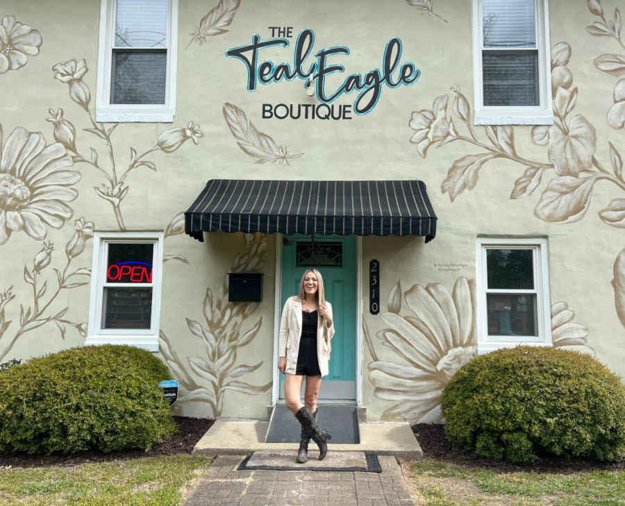 Tatiana Hill recreates her boutique’s grand opening picture from 2019 on April 14, 2023.