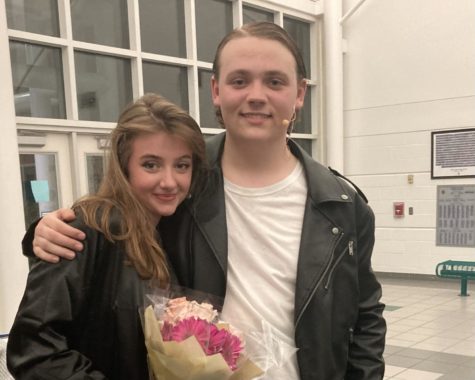 Junior Wren Thomas (Danny Zuko) and Freshman Anneliese (Sandy Dumbrowski) celebrate their preformance in Grease on May 6, 2023, in the cafeteria foyer.