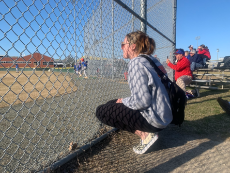Emerson Hundley training at the Ocean Lakes vs Princess Anne varsity baseball game, watching from behind the fence line on Mar 30, 2023.