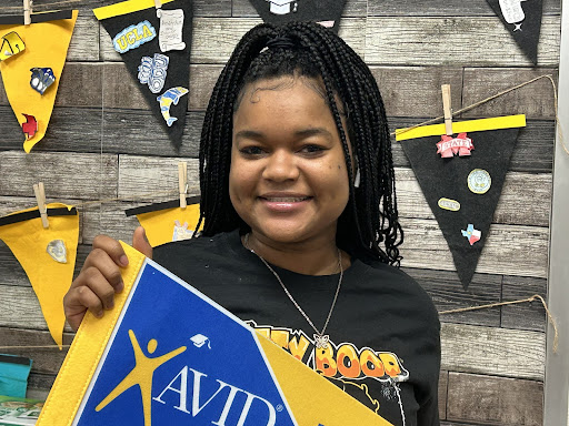 Junior Shaliyah Barnes poses with an AVID pendant.