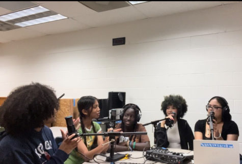 From left to right Amya Stroman, Kamea Averilla, Diarra Sene, Layla Simpson and Allena Gillard record a podcast together in the library on May 30, 2023. 