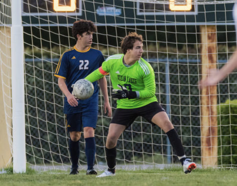Senior Michael Arzillo saves Ocean Lakes Dolphins against Princess Anne Cavaliers at Cox High School, on May 5, 2023. 