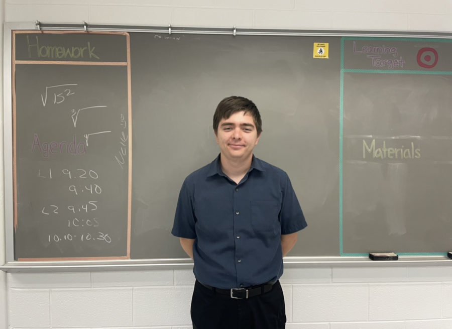 Math tutor Greg Goldston stands in front of the his classrooms blackboard on May 24, 2023. 
