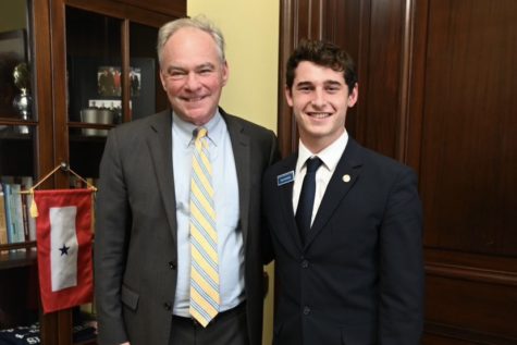Junior Drew Goodove and Senator Tim Kaine smile for a picture after conversing in May of 2022.
