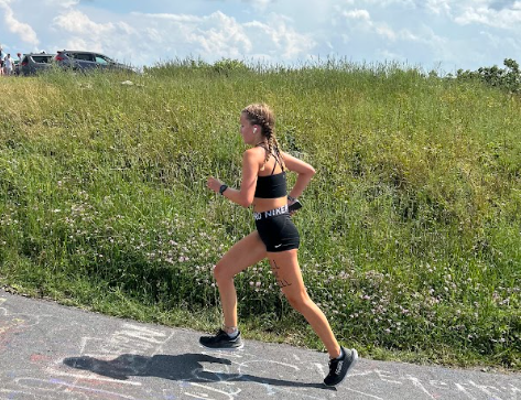 Junior Lindsay Meadows runs up Reddish Knob at Blue Ridge Running Camp  on July. 25, 2023, to prepare for the upcoming season.