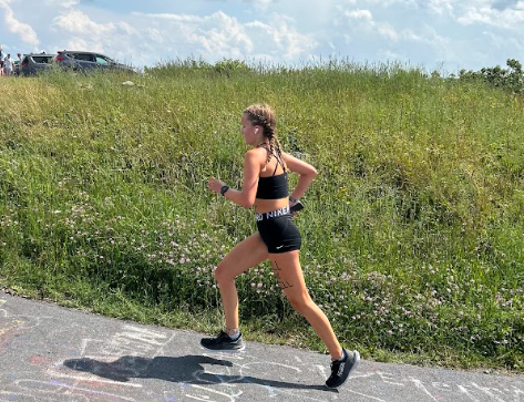 Junior Lindsay Meadows runs up Reddish Knob at Blue Ridge Running Camp  on July. 25, 2023, to prepare for the upcoming season. Photo used with permission from Roman Chapman. 