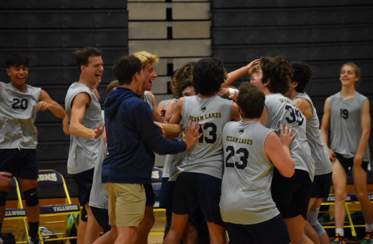 Boys+volleyball+celebrates+after+a+3-0+take+down+against+the+Tallwood+Lions+on+Oct.+3+2023%2C+at+Tallwood+High+School.