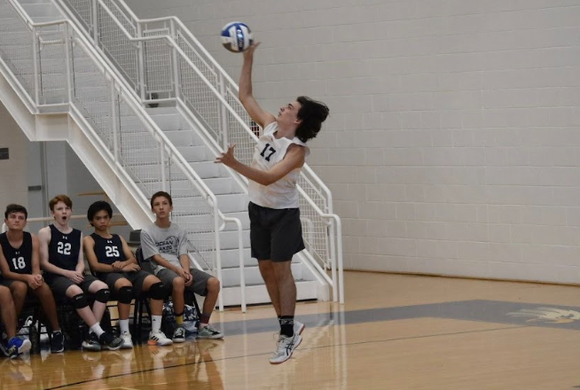 Junior Gavin Juhas serves the ball against Landstown High School at Landstown High School on Aug. 29, 2023. Photo used with permission from Diana Holloway.