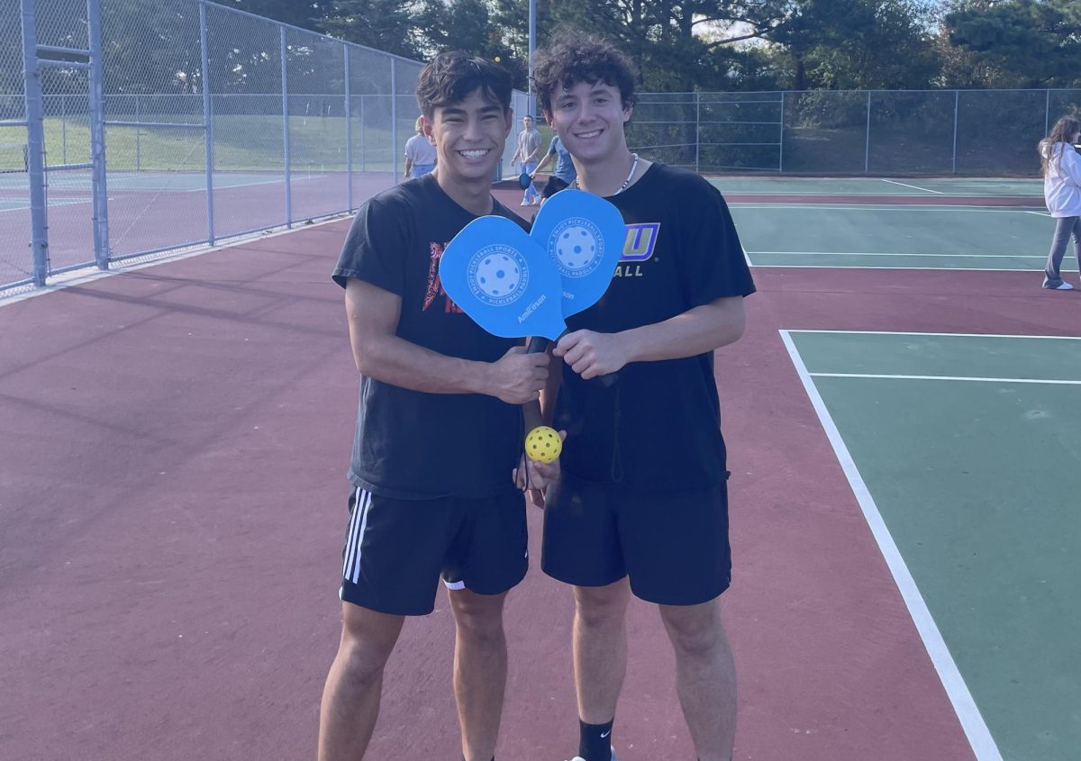 (from left) Teammates David Suiter and Dylan Gallahue show their excitement for pickleball in between games on Oct. 18, 2023. The two have been fixtures at club meetings thus far. 