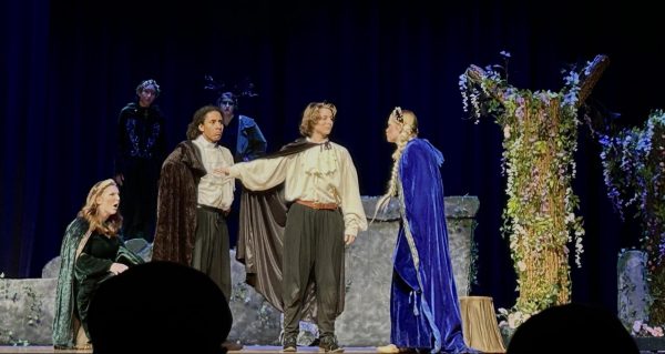 From left: sophomore Elanor Strader (Hermina), junior Deven Bailey (Lysander), senior Jae Cook (Demetrius) and sophomore Grace Kavanaugh (Helena) argue about love interests in the production of “A Midsummer Night’s Dream” on opening night, Nov. 16, 2023. They play the young lovers in A Midsummer Nights Dream