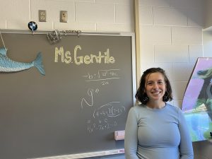 Stephanie Gentile writes down the quadratic formula as well as complex numbers during one lunch in Room 256 on Oct. 24, 2023.
