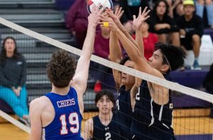 Seniors Vincent Yi and Daved Holloway work together to block Kempsville hitter Ryan Pecora during the region championship game on Nov. 7, 2023 at Deep Creek High School.